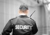 Security guard holding a walkie talkie