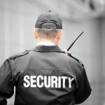 Security guard holding a walkie talkie
