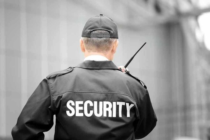 Security guard holding a walkie talkie