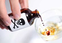 Person pouring liquid from poison bottle into glass