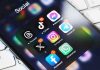 Smartphone showing social media app icons in a folder.