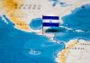 Map of Central America with a flag of El Salvador pinned on it