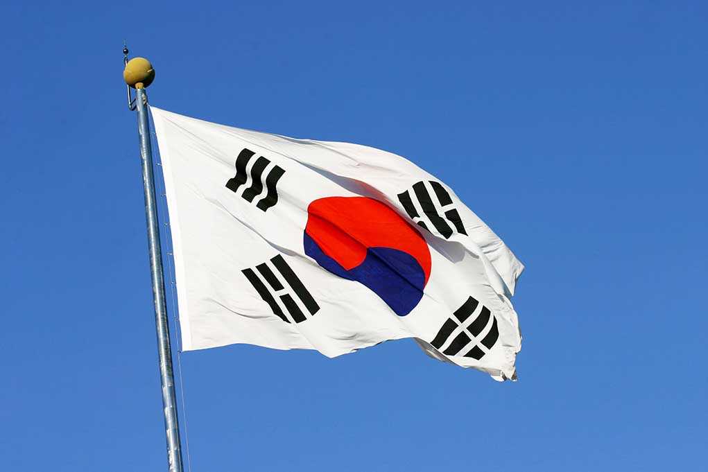 South Korean flag waving against a clear blue sky