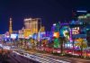 Las Vegas Strip at night with bright neon lights.