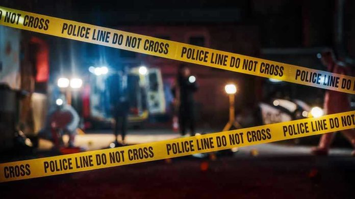 Yellow police tape in front of crime scene.