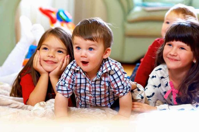 shutterstock_125877587.jpg A group of children enjoying playtime indoors, displaying joyful expressions