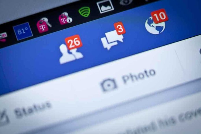Close-up of a smartphone screen displaying Facebook notifications