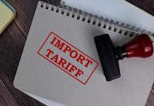 Tariff Fury – Americans Facing Negative Spike! Notebook with Import Tariff stamp and rubber stamper.