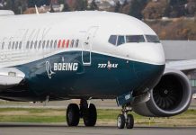 Boeing’s $4.9 Billion WASTE—Investors FUMING! Boeing 737 MAX airplane on runway.