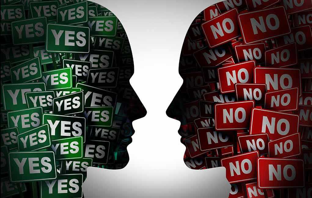 Silhouettes filled with YES and NO signs facing each other.
