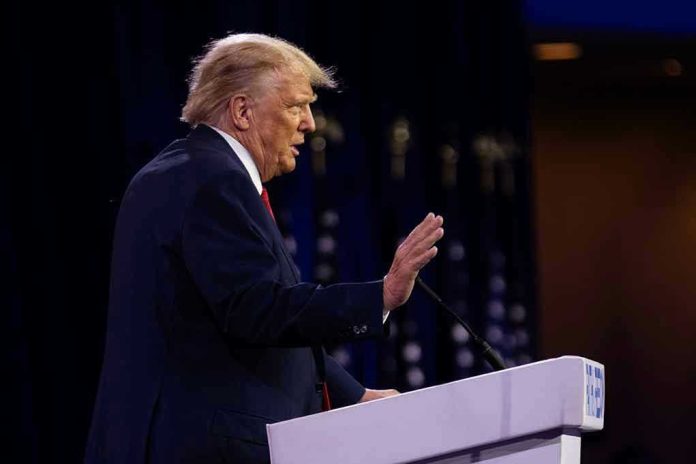 2322692285 Person speaking at a podium with hand raised
