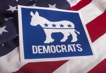 Dem States SUING Trump – Government EXPLODES! Democrats logo on American flag background