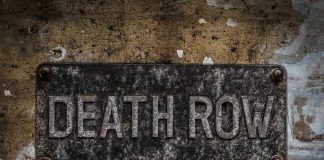 Weathered Death Row sign on aged concrete wall