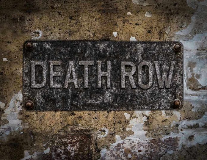 533872477 Weathered Death Row sign on aged concrete wall