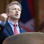 Rand Paul WARNS Trump: MAGA Revolt Coming Man in a suit passionately delivering a speech at a podium