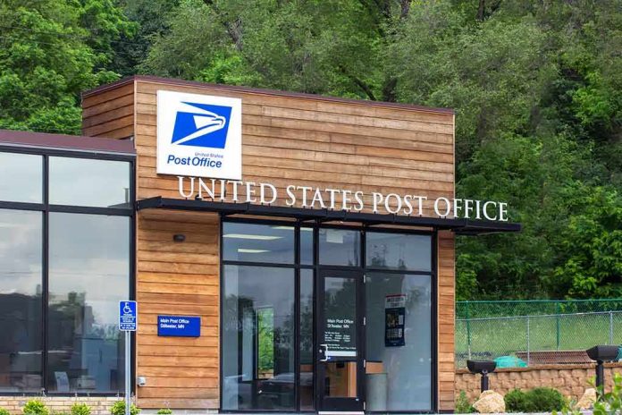 shutterstock_206357437.jpg Exterior view of a modern United States Post Office building surrounded by greenery