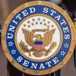 Sign displaying United States Senate in a government building