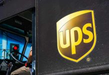 UPS delivery truck driver at traffic light
