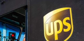 UPS delivery truck driver at traffic light