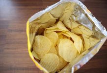 Open bag of ridged potato chips