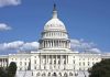 U.S. Capitol building against blue sky.