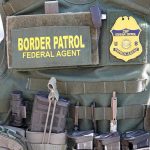 Midtown Shootout—Shots Fired at Border Feds Border Patrol vest with gear and communication equipment.