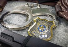 Weather Balloon Suicide Plot Stuns Investigators Handcuffs, officer badge, and firearm on textured surface.