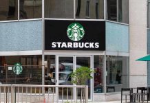 Nationwide Strikes Rock Starbucks – Corporate Assault! Starbucks storefront with glass doors and logo