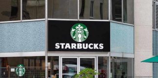 Starbucks storefront with glass doors and logo