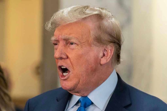 2369816081 Man in suit with open mouth, speaking passionately.