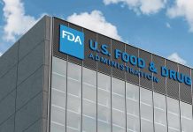 FDA building with blue logo and sky background.