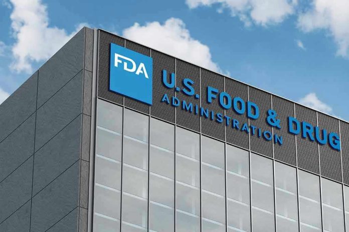 2454487921 FDA building with blue logo and sky background.