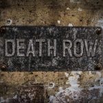 Death Row SHOCK – Governor Halts Execution Last Minute Weathered Death Row sign on aged concrete wall