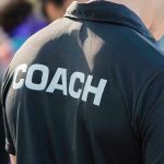 Coach’s Dark Secrets Exposed: Urgent Manhunt Person wearing a shirt labeled Coach.