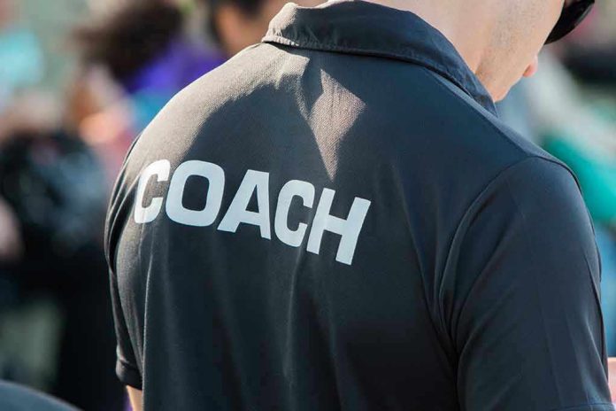 Person wearing a shirt labeled Coach.