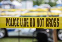 OnlyFans Stars MURDERED – Disturbing Pattern Emerges Yellow police line tape with Do Not Cross.