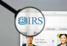 Magnifying glass over IRS website.
