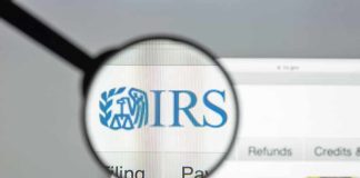 Magnifying glass over IRS website.