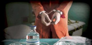 Vial labeled Sodium Thiopental near handcuffed person.