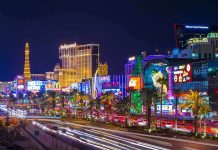 Vibrant view of the Las Vegas Strip at night with neon lights and traffic