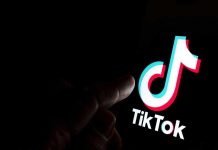 Tragic TikTok Trend: Athlete’s Death Stuns Nation Finger pointing at TikTok logo on a screen.