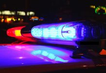 Illegal Alien AMBUSHES Cops – Gas Station Turns Into War Zone Police car lights flashing red and blue.