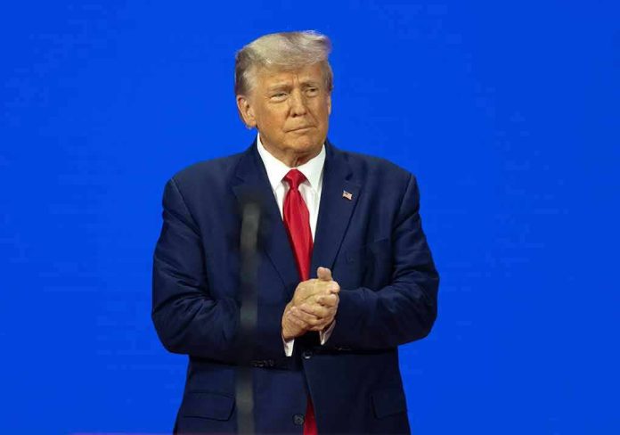 Man in a suit with a blue background.