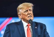 Trump OBLITERATES Ghetto Congresswoman’s Senate Ambitions Man in suit speaking at a microphone.