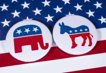 Dem Donors ERUPT Over ‘Scumbag’ Candidate After Party Flip Republican elephant and Democrat donkey on American flag.
