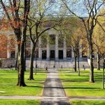 University SHOOTING SPREE – Multiple Victims Down Students walking on a university campus with autumn trees and a historic building in the background