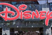 Bright red Disney logo displayed on a storefront window