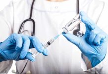 MAGA Patients DENIED Anesthesia Doctor filling syringe with vaccine from vial.
