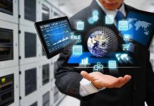 Businessman holding virtual data and analytics hologram.