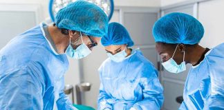 Surgeons performing an operation in a sterile environment.